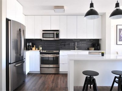 Kitchen with refrigerator and some stools